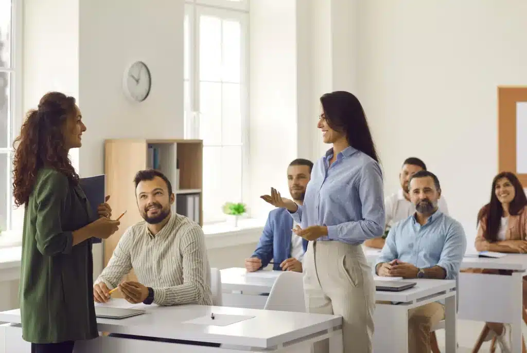 Instructor teaching adult students in a classroom